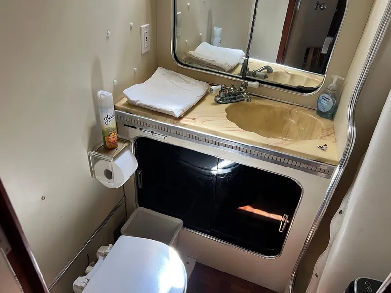 Slide: The Image of Bathroom interior of 1986 Chris-Craft 381 Catalina yacht with sink and toilet. - 20