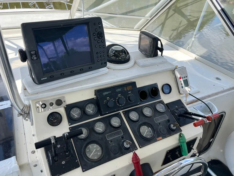 Slide: The Image of 1986 Chris-Craft 381 Catalina helm with navigation equipment and control gauges. - 5