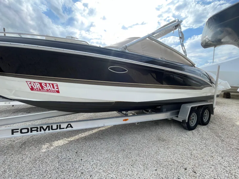 Slide: The Image of 2012 Formula 270 Bowrider boat for sale on trailer, side view. - 0