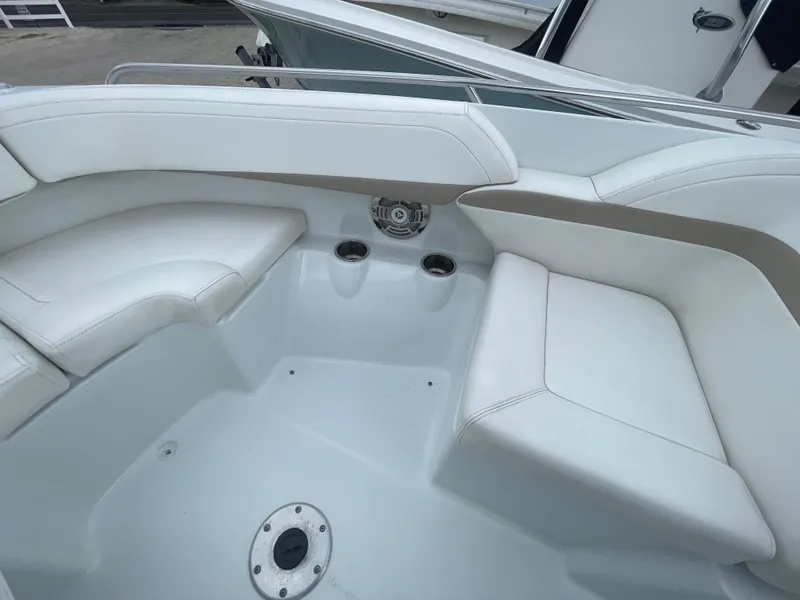 Slide: The Image of 2012 Formula 270 Bowrider interior with white seating and cup holders. - 11