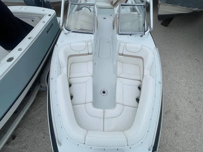 Slide: The Image of 2012 Formula 270 Bowrider boat with spacious seating and sleek design. - 12