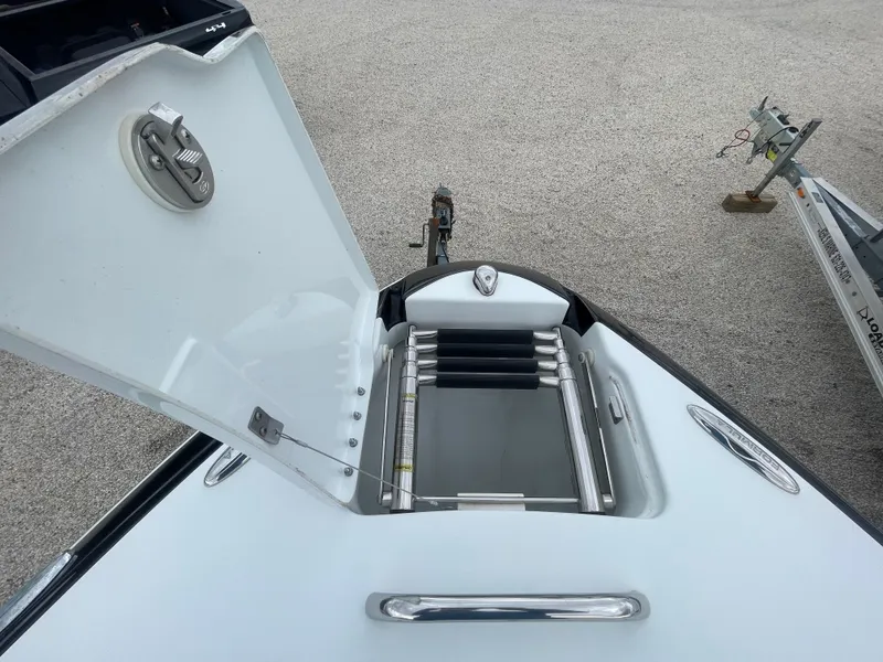 Slide: The Image of Open hatch of 2012 Formula 270 Bowrider boat showing ladder storage. - 13