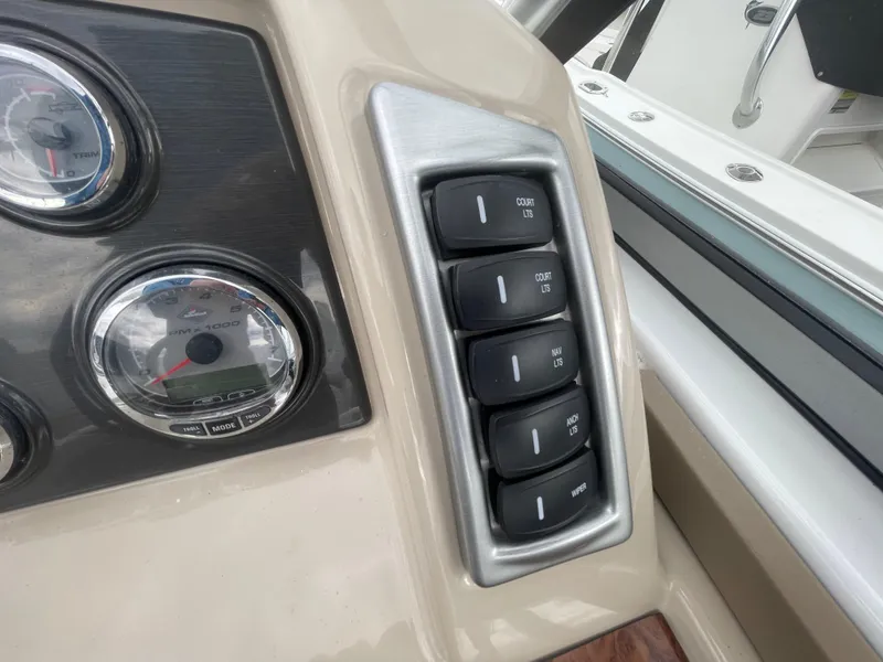Slide: The Image of Control panel of a 2012 Formula 270 Bowrider boat with gauges and switches. - 19