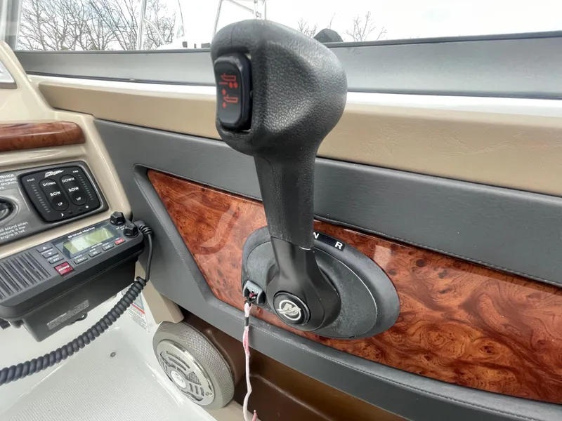 Slide: The Image of 2012 Formula 270 Bowrider dashboard with throttle control and radio system. - 22