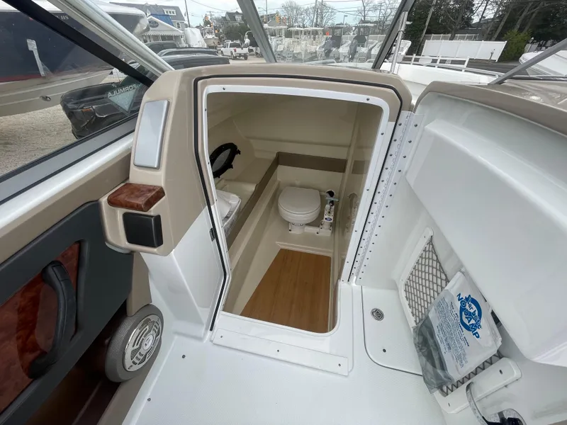 Slide: The Image of 2012 Formula 270 Bowrider boat interior with compact bathroom and toilet. - 24