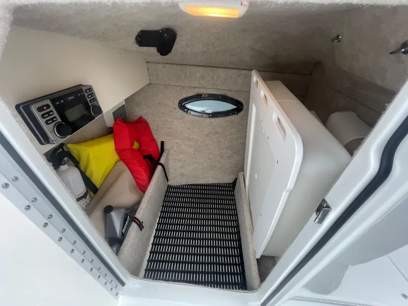 Slide: The Image of Interior cabin of a 2012 Formula 270 Bowrider with safety gear and equipment. - 26