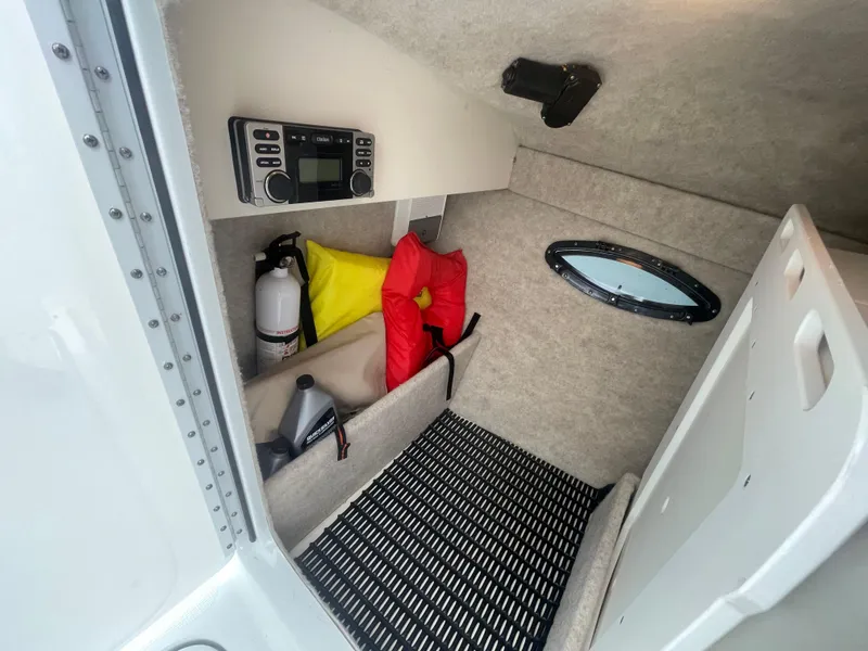 Slide: The Image of Interior cabin of 2012 Formula 270 Bowrider with safety equipment and storage. - 27
