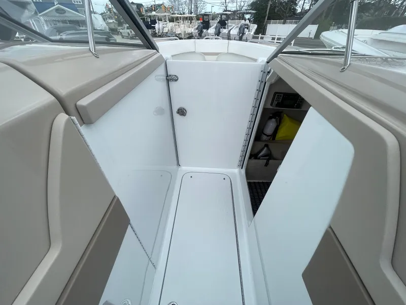 Slide: The Image of 2012 Formula 270 Bowrider interior with beige seating and white flooring. - 29