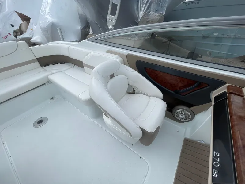 Slide: The Image of 2012 Formula 270 Bowrider interior with white seating and sleek design. - 34