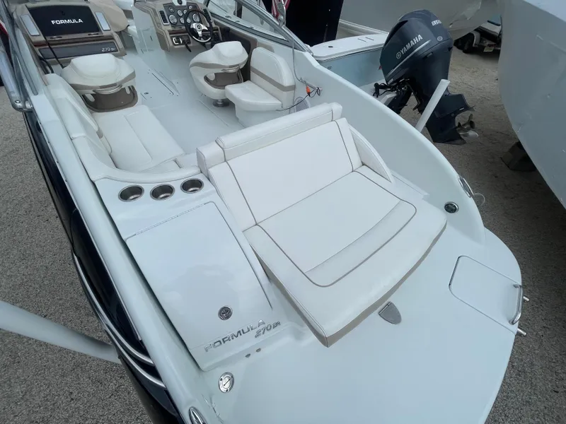 Slide: The Image of 2012 Formula 270 Bowrider boat with white seating and Yamaha outboard motor. - 39