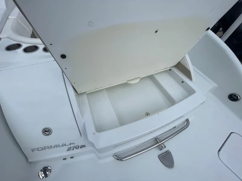 Slide: The Image of 2012 Formula 270 Bowrider storage compartment with open lid, showcasing sleek design and functionality. - 40