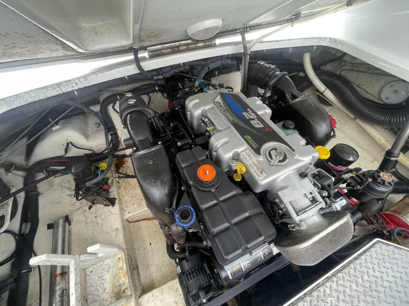 Slide: The Image of Engine compartment of a 2012 Formula 270 Bowrider boat, showcasing detailed mechanical components. - 45