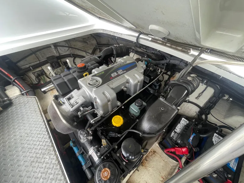 Slide: The Image of Engine compartment of a 2012 Formula 270 Bowrider boat, showcasing detailed mechanical components. - 47
