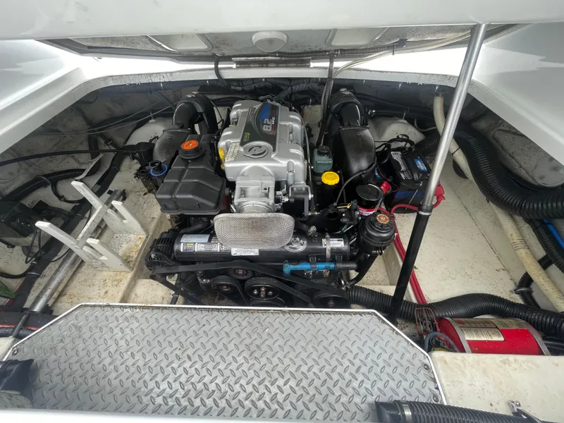 Slide: The Image of Engine compartment of a 2012 Formula 270 Bowrider boat, showcasing detailed mechanical components. - 48