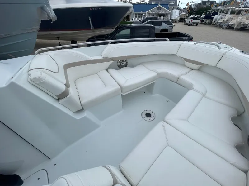 Slide: The Image of 2012 Formula 270 Bowrider boat with spacious white seating area. - 6