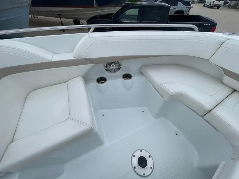 Slide: The Image of 2012 Formula 270 Bowrider interior with white seating and cup holders. - 8