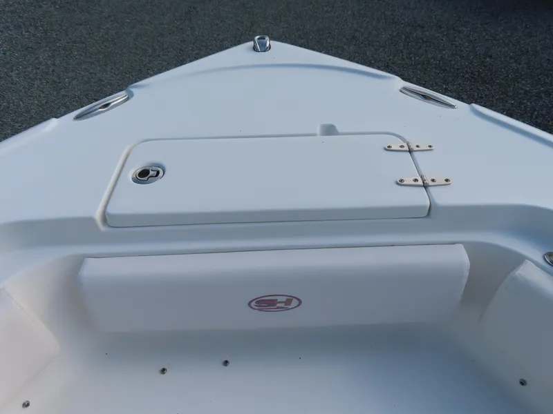 Slide: The Image of Bow of 2021 Sea Hunt Ultra 234 boat with storage compartment. - 12