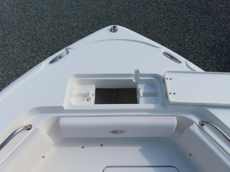 Slide: The Image of Bow of 2021 Sea Hunt Ultra 234 boat with storage compartment and sleek design. - 13