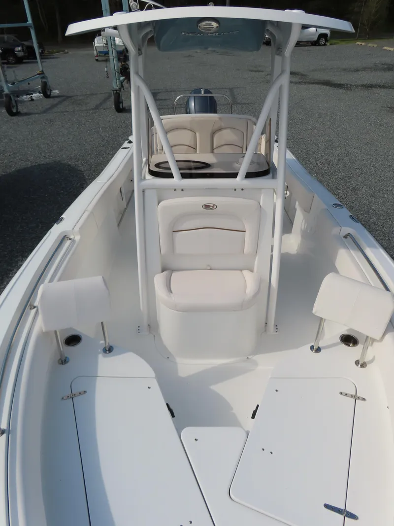Slide: The Image of 2021 Sea Hunt Ultra 234 boat with spacious deck and seating. - 14