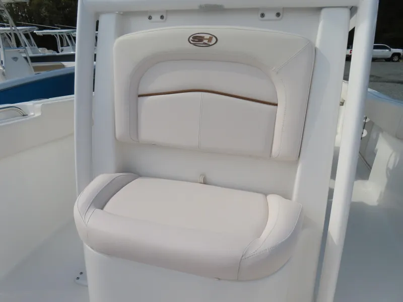 Slide: The Image of 2021 Sea Hunt Ultra 234 boat seat, white cushioned design, sleek and comfortable. - 17