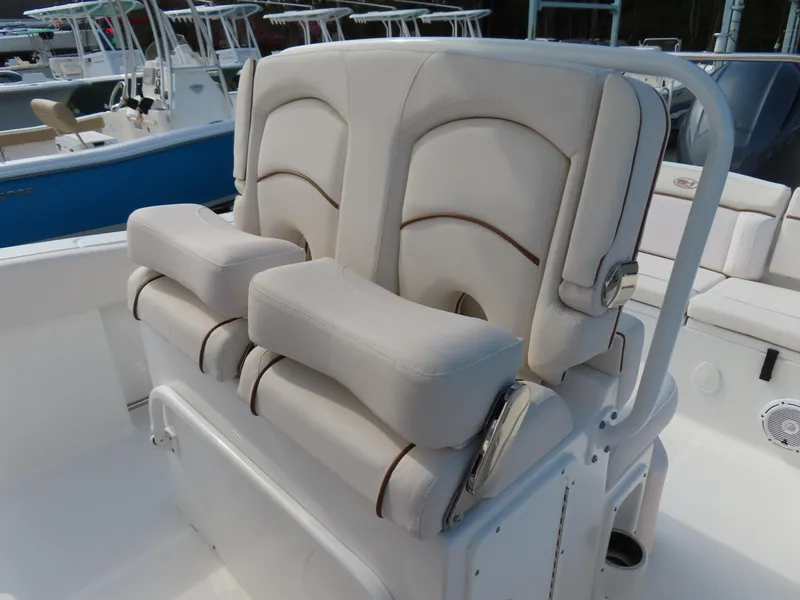 Slide: The Image of 2021 Sea Hunt Ultra 234 boat with comfortable dual seating and white upholstery. - 22