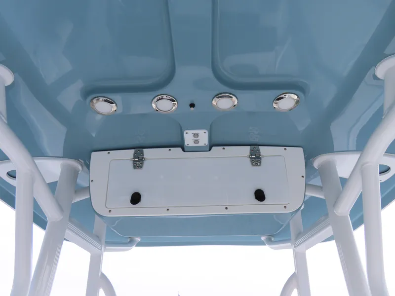Slide: The Image of 2021 Sea Hunt Ultra 234 boat T-top with storage compartment and lights. - 27