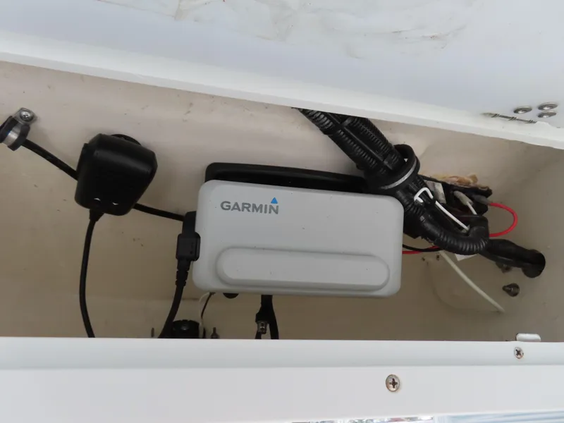 Slide: The Image of Garmin device installed in a 2021 Sea Hunt Ultra 234 boat compartment. - 28