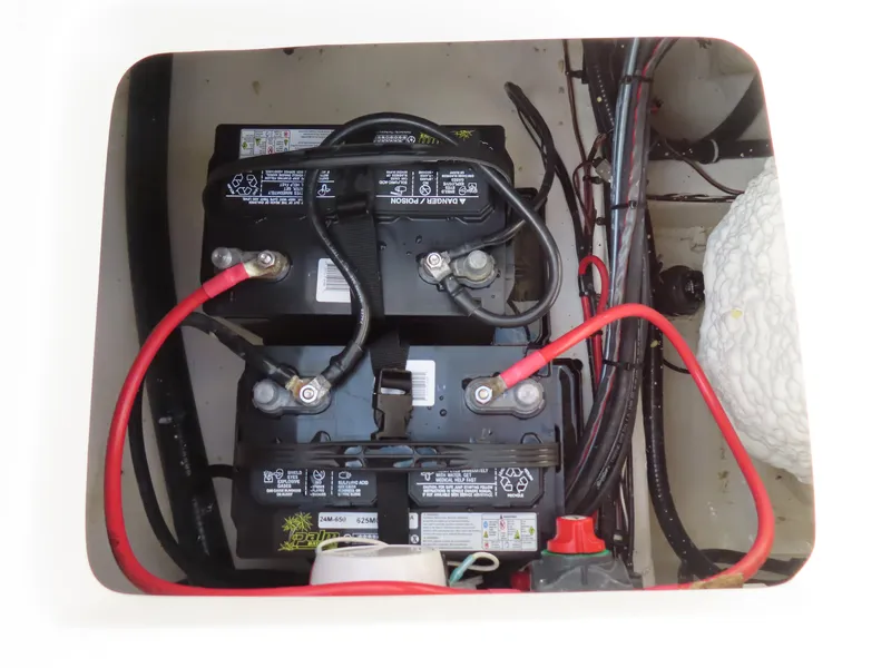 Slide: The Image of Battery compartment of 2021 Sea Hunt Ultra 234 boat with wiring connections. - 36