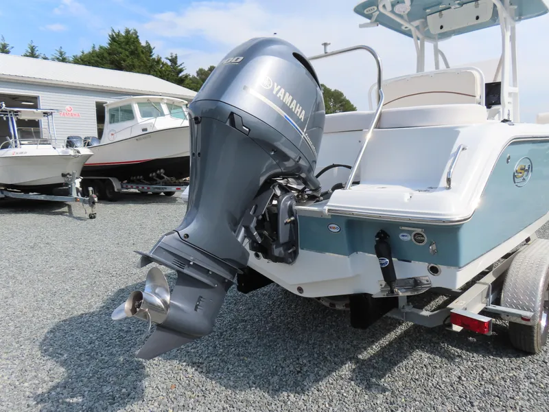 Slide: The Image of 2021 Sea Hunt Ultra 234 boat with Yamaha outboard motor on trailer. - 4