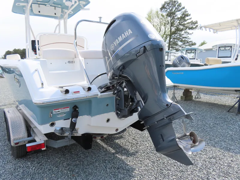 Slide: The Image of 2021 Sea Hunt Ultra 234 boat with Yamaha outboard motor on a trailer. - 5