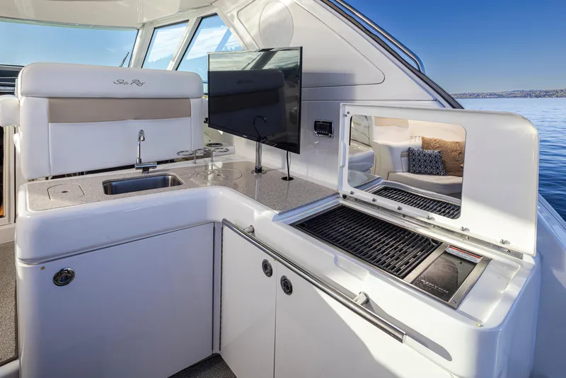 Slide: The Image of Luxurious 2010 Sea Ray Sundancer yacht interior with kitchenette and grill. - 10