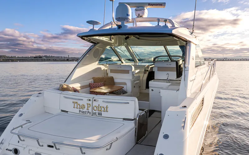 Slide: The Image of 2010 Sea Ray Sundancer yacht on calm water at sunset. - 3