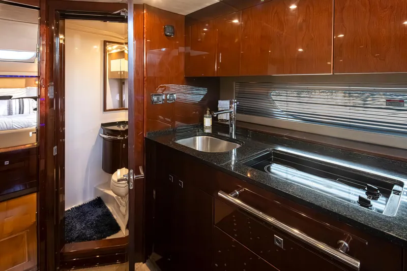 Slide: The Image of Luxurious 2010 Sea Ray Sundancer yacht interior with modern kitchen and bathroom. - 32