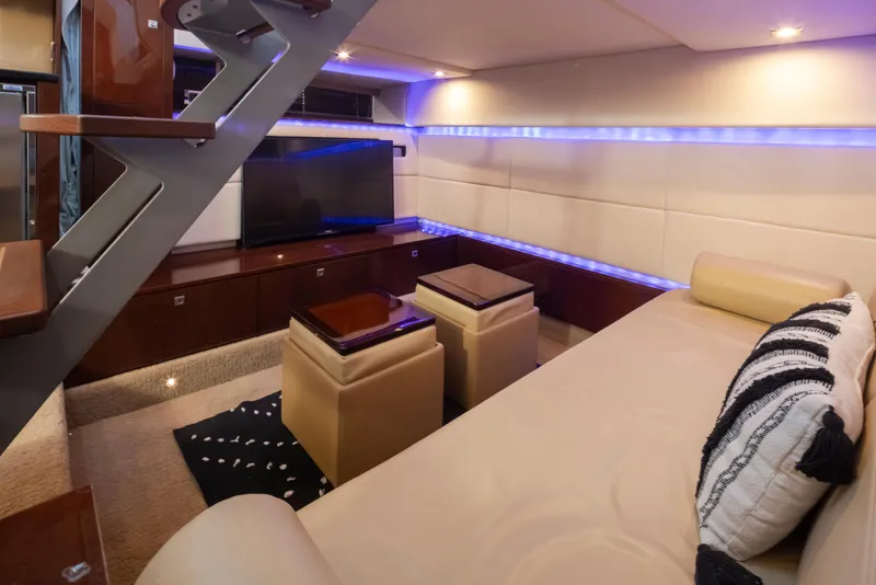 Slide: The Image of Luxurious interior of 2010 Sea Ray Sundancer yacht with modern seating and ambient lighting. - 35