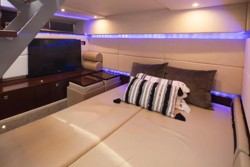 Slide: The Image of Luxurious interior of 2010 Sea Ray Sundancer yacht with cozy seating and ambient lighting. - 38