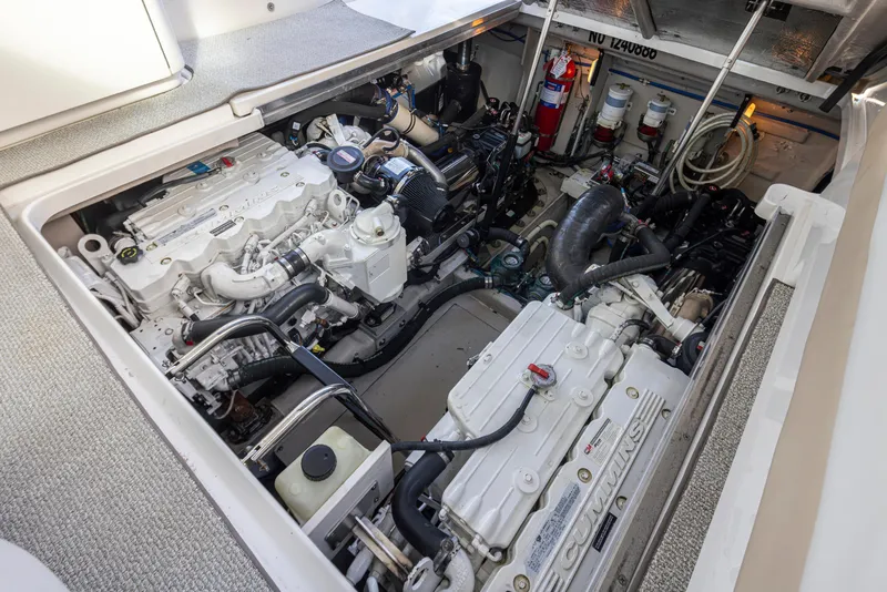 Slide: The Image of Engine compartment of a 2010 Sea Ray Sundancer boat, featuring Cummins engines. - 48