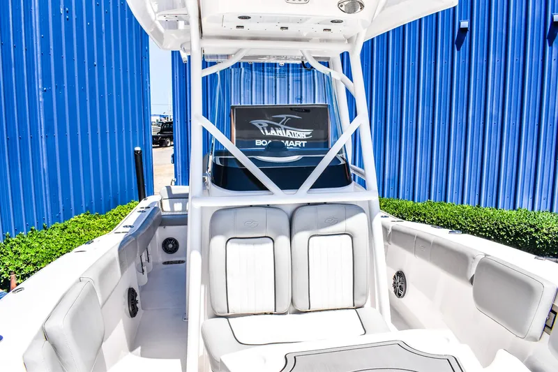 Slide: The Image of 2022 Sea Fox 228 Commander boat with white seating and blue exterior. - 10