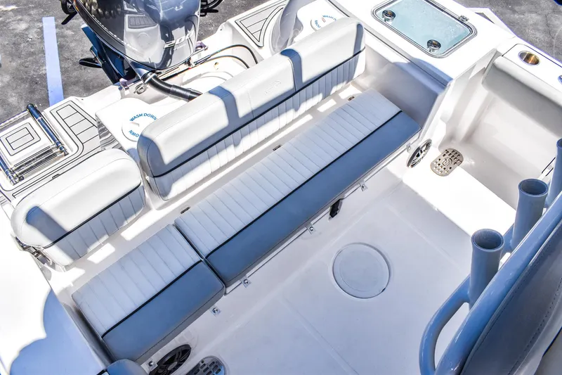 Slide: The Image of 2022 Sea Fox 228 Commander boat interior with cushioned seating and storage compartments. - 3