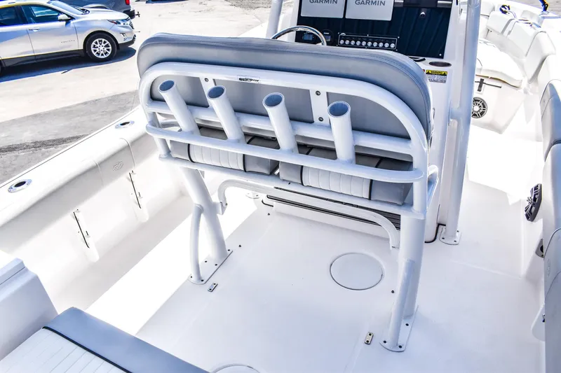 Slide: The Image of 2022 Sea Fox 228 Commander boat interior with rod holders and seating. - 4