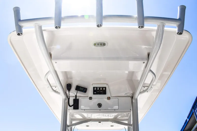 Slide: The Image of 2022 Sea Fox 228 Commander boat T-top with rod holders and electronics. - 5