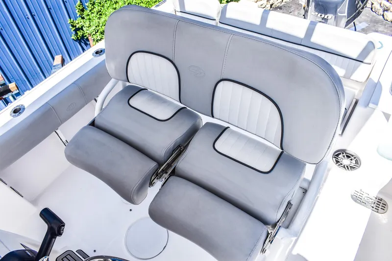 Slide: The Image of 2022 Sea Fox 228 Commander boat seating, featuring comfortable gray and white cushioned seats. - 7