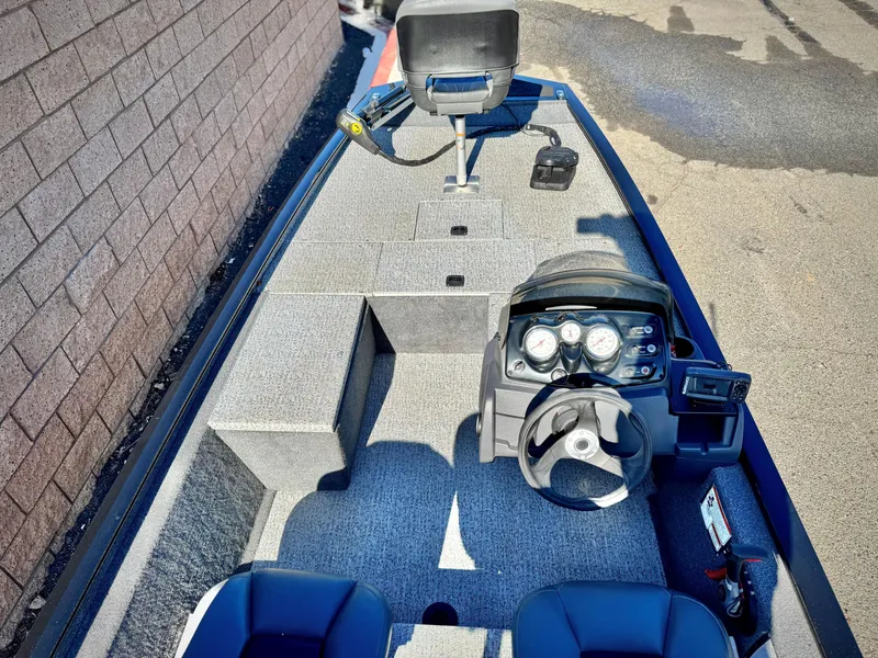 Slide: The Image of 2024 Tracker Pro 170 boat interior with steering wheel and seating. - 12