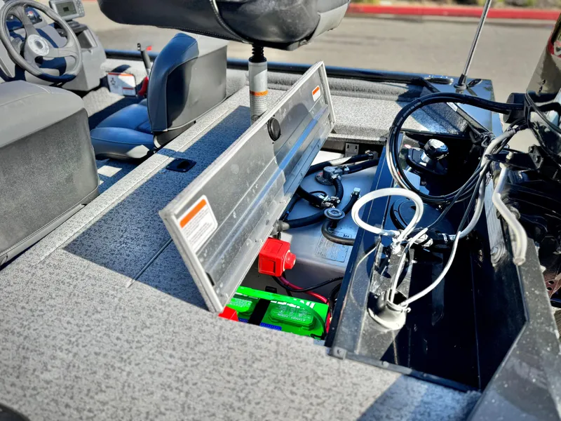 Slide: The Image of 2024 Tracker Pro 170 boat interior showing battery compartment and seating area. - 18