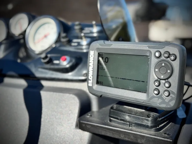 Slide: The Image of 2024 Tracker Pro 170 dashboard with Lowrance fish finder and gauges. - 22