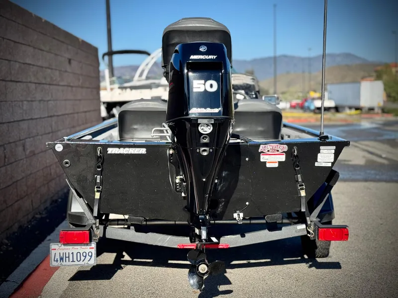 Slide: The Image of 2024 Tracker Pro 170 boat with Mercury 50 engine, parked on a trailer. - 4