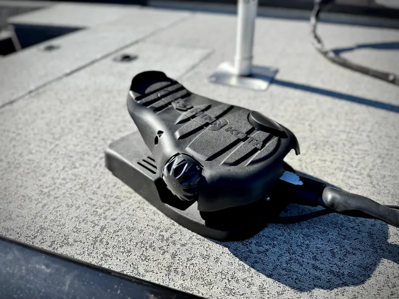 Slide: The Image of 2024 Tracker Pro 170 boat deck with mounted black foot pedal control. - 9