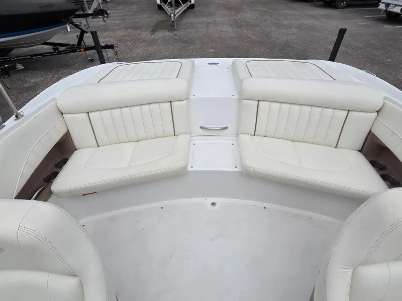 Slide: The Image of 2008 Cobalt 220 boat interior with white leather seating. - 10