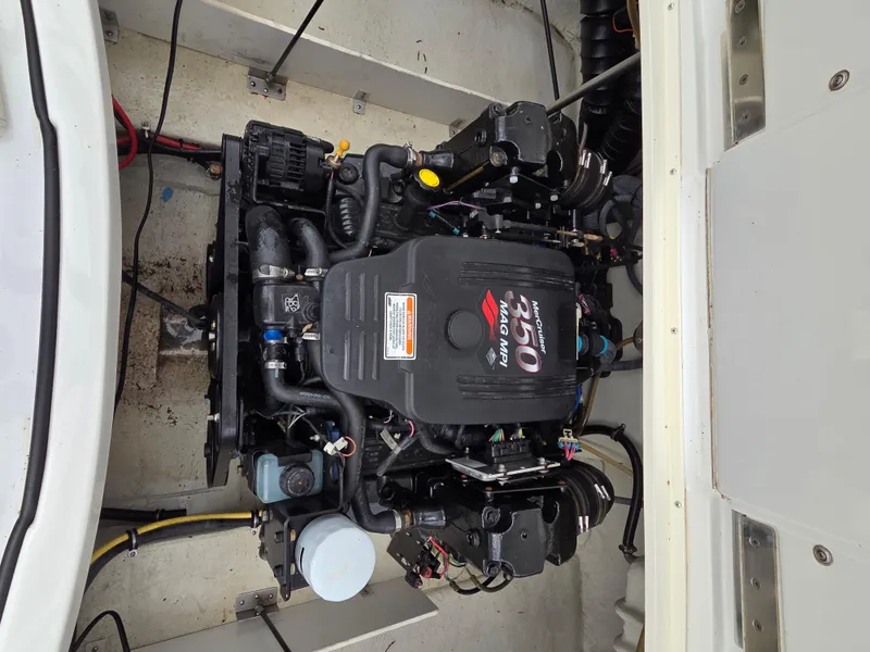 Slide: The Image of Engine compartment of a 2008 Cobalt 220 boat, showcasing the engine layout. - 11