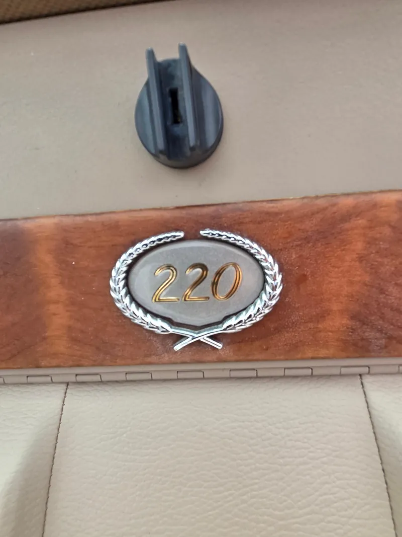 Slide: The Image of 2008 Cobalt 220 emblem on wood panel with laurel wreath design. - 14