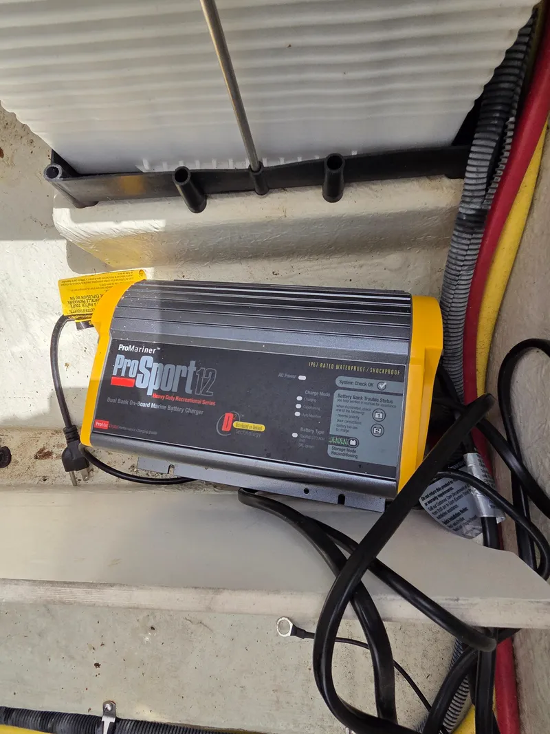 Slide: The Image of Onboard battery charger in a 2008 Cobalt 220 boat. - 16